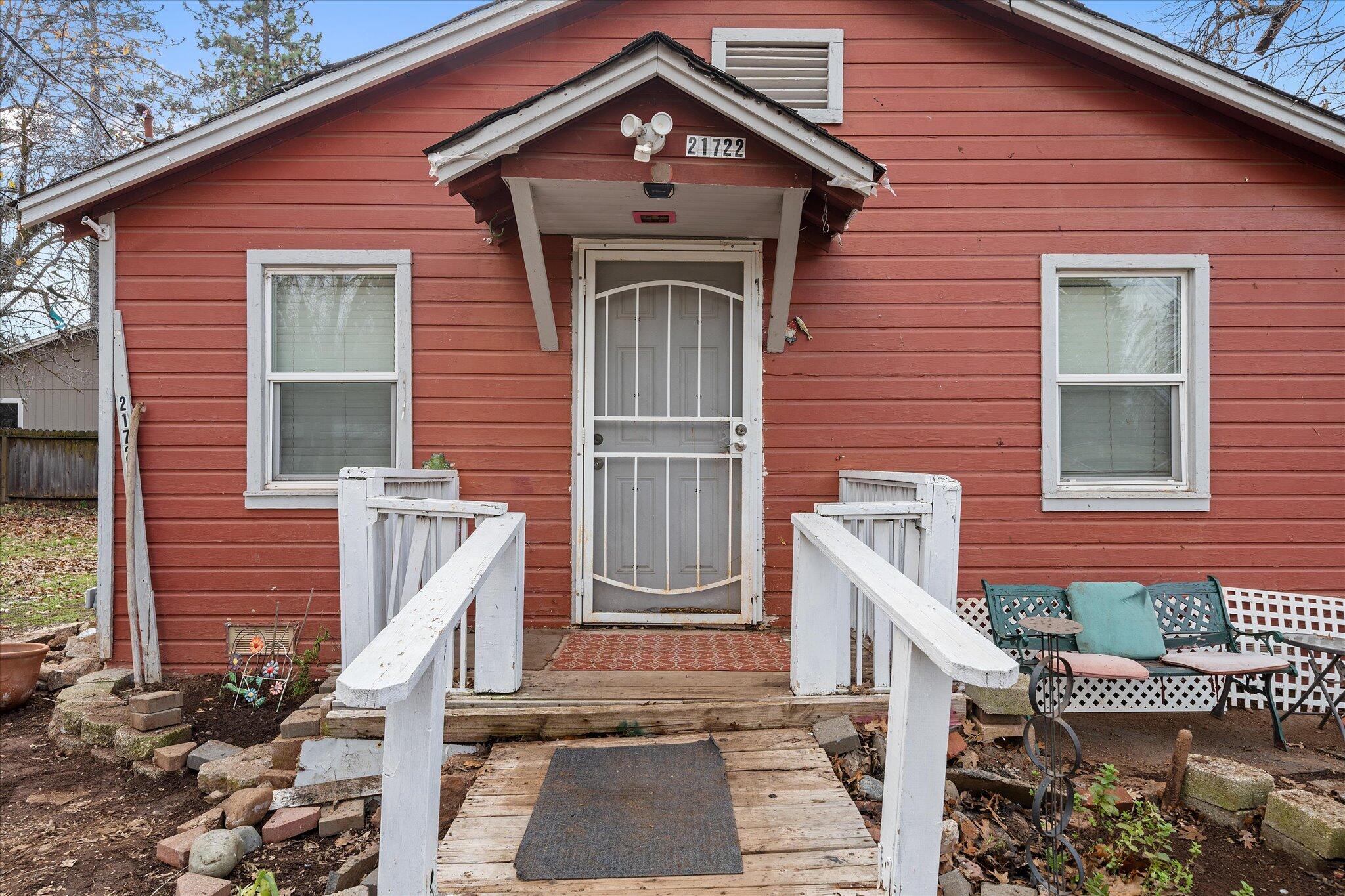 21722 3rd Street Burney, CA 96013 - Photo 3 of 33 a front view of a house with a yard