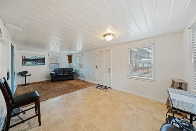 a view of livingroom with furniture and windows
