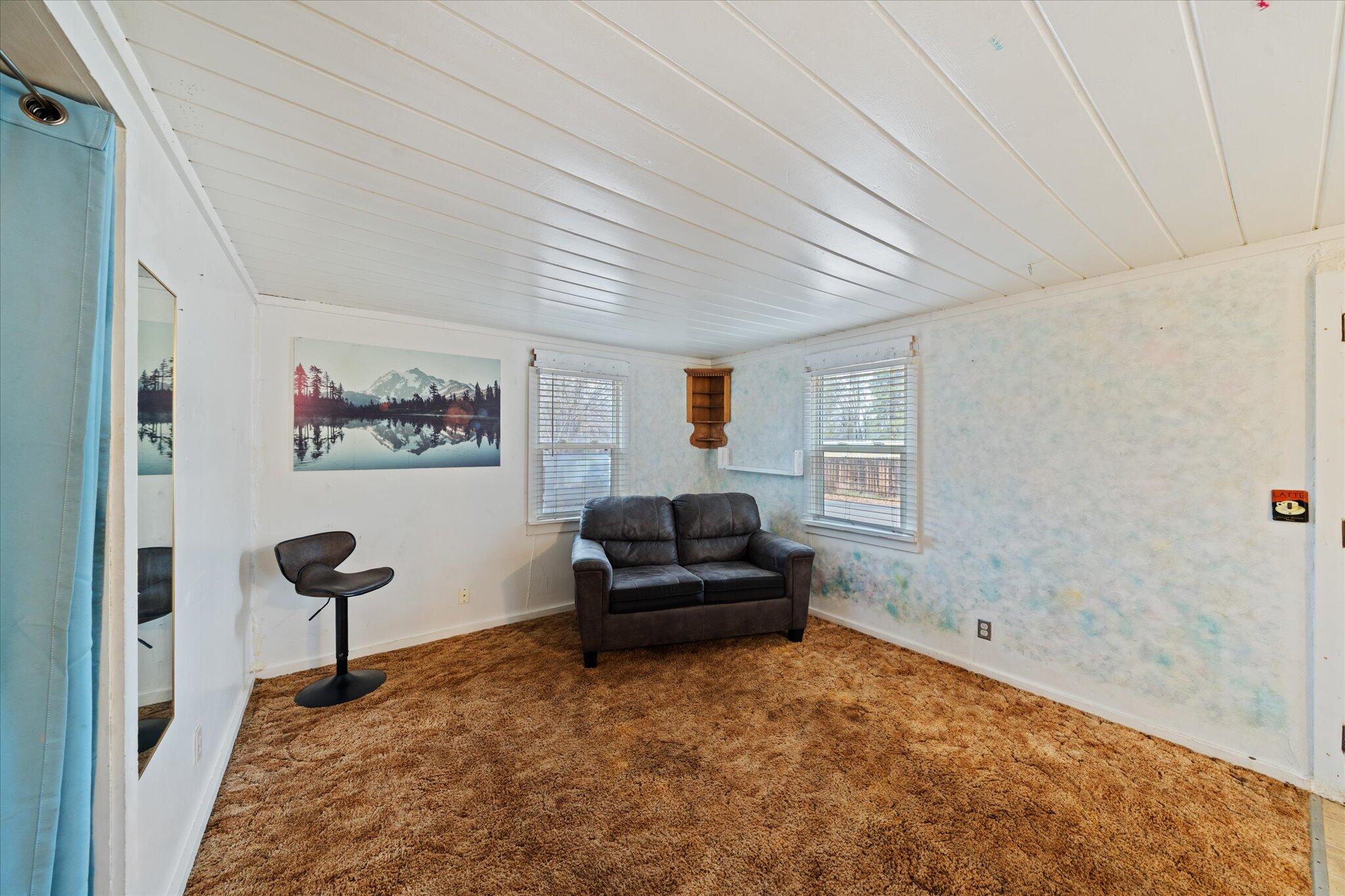 21722 3rd Street Burney, CA 96013 - Photo 7 of 33 a living room with furniture and a window