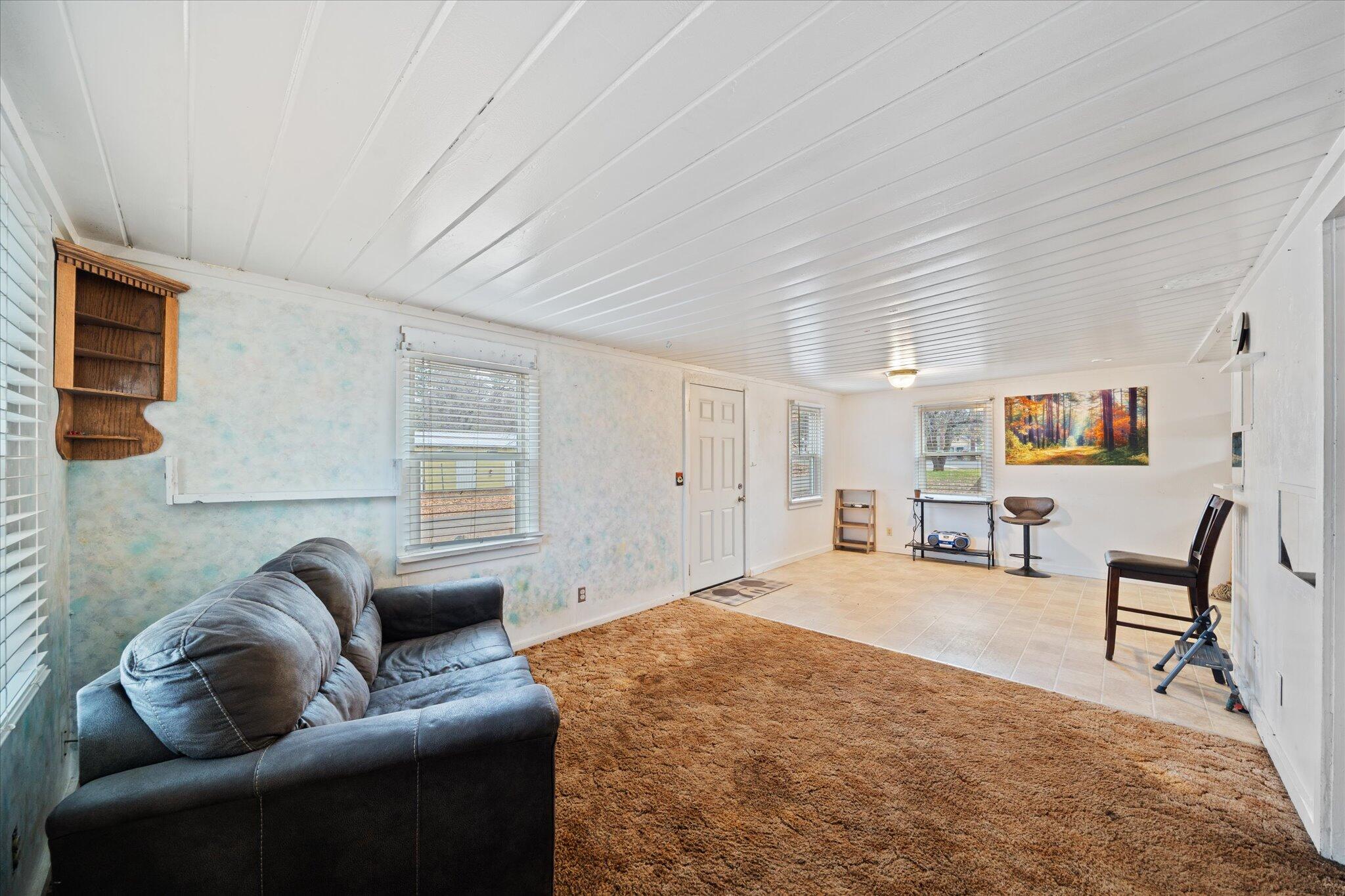 21722 3rd Street Burney, CA 96013 - Photo 8 of 33 a spacious bedroom with a bed a couch and dresser