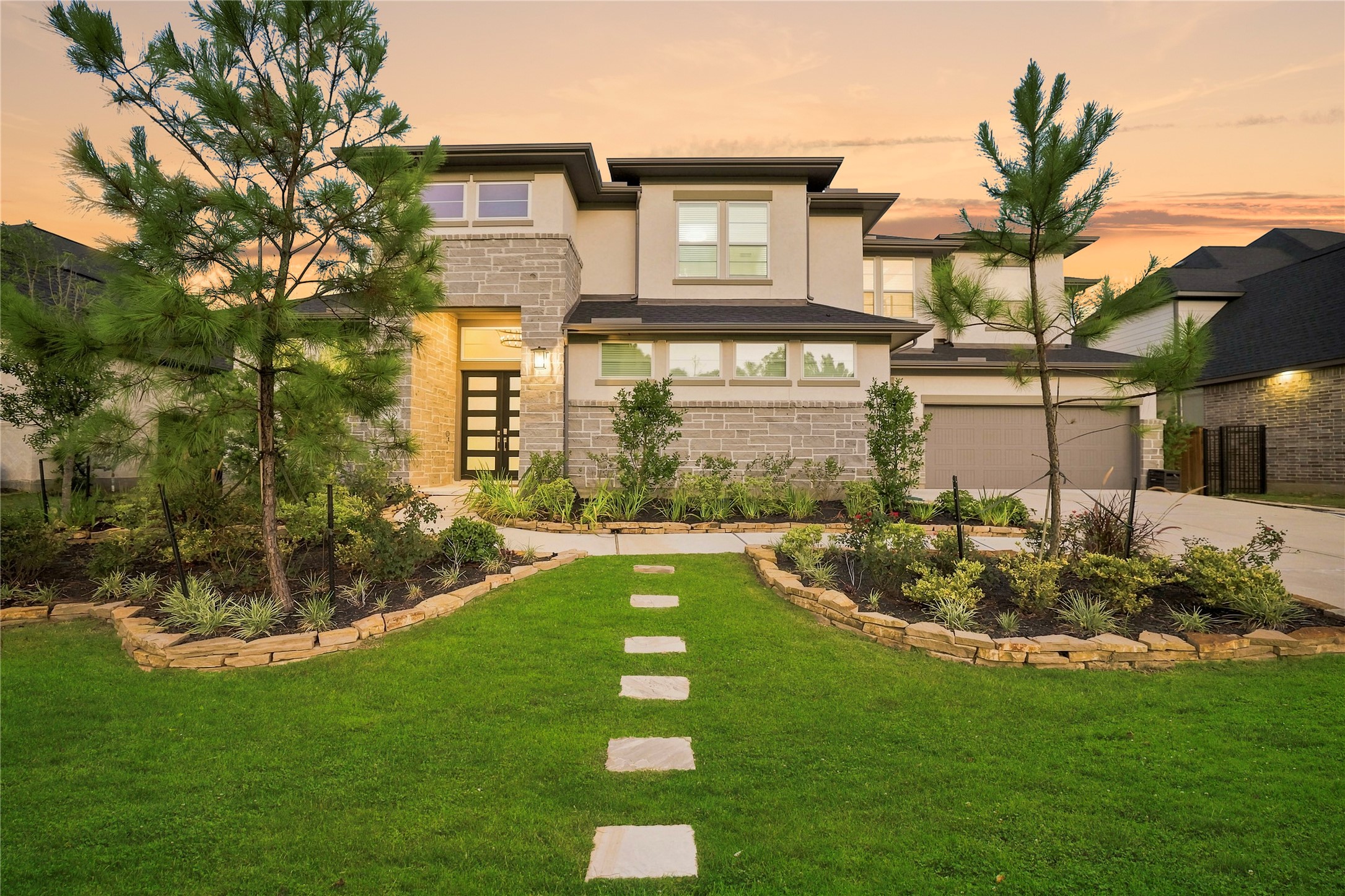 4130 Pleasant Ridge Drive Spring, TX 77386 - Photo 41 of 46 Another breathtaking evening view showcasing the home's beautiful exterior, perfectly framed by a stunning Texas sunset.