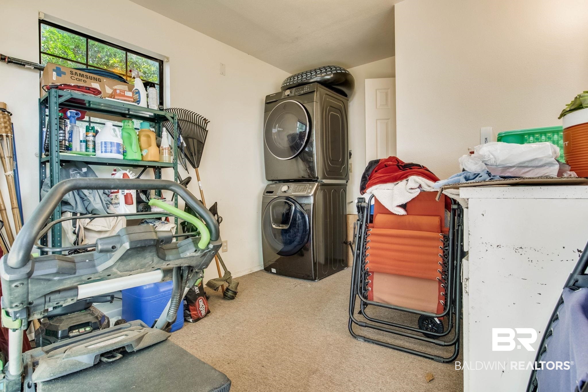 272 Defuniak Circle Lillian, AL 36549 - Photo 7 of 26 Laundry area featuring stacked washer / dryer and carpet flooring