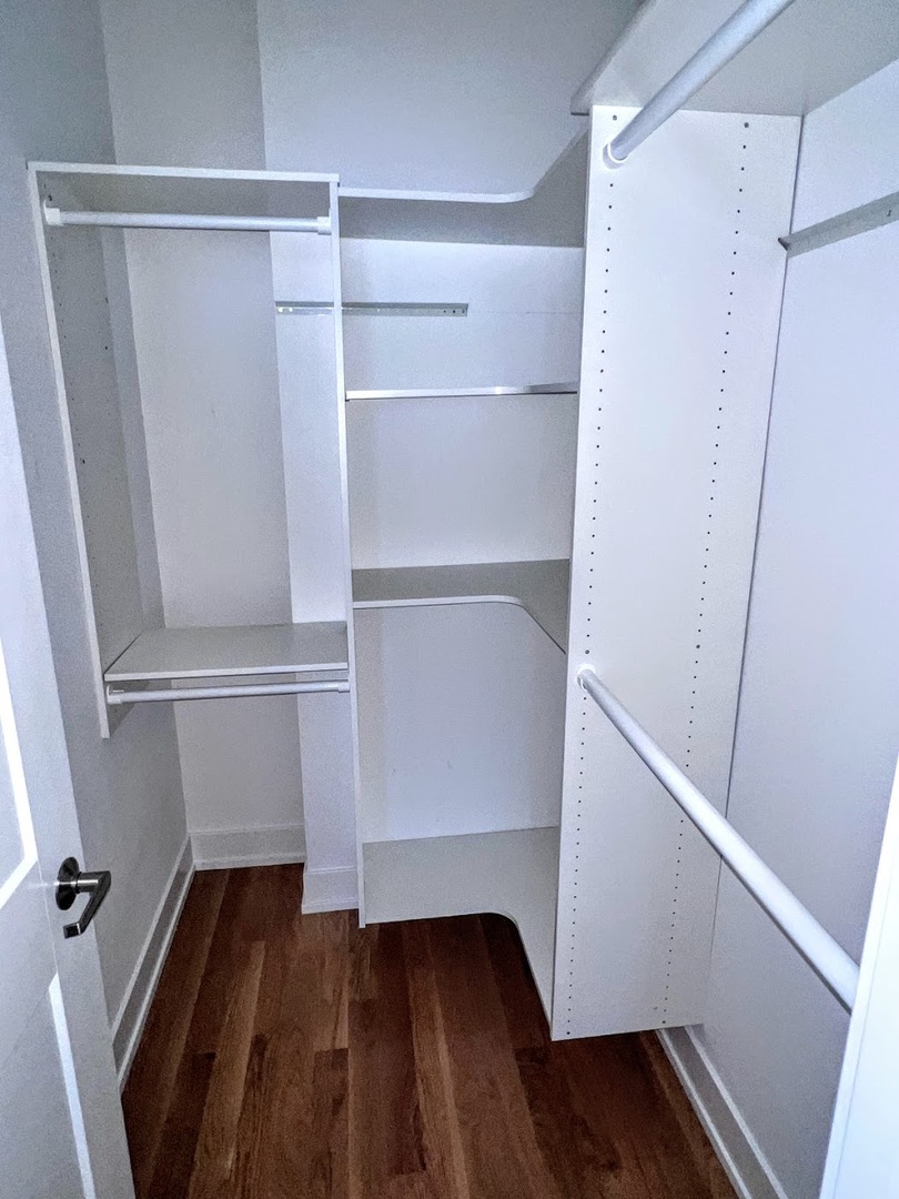 3203 North Ridgeway Avenue, Unit 3C Chicago, IL 60618 - Photo 12 of 17 a view of walk in closet with wooden floor