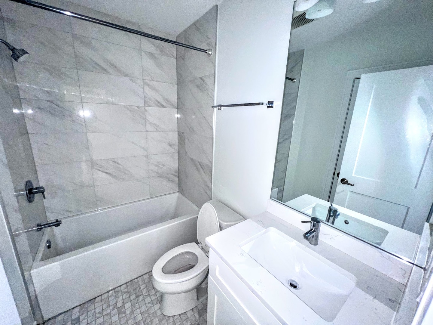 3203 North Ridgeway Avenue, Unit 3C Chicago, IL 60618 - Photo 13 of 17 a bathroom with a sink toilet and shower