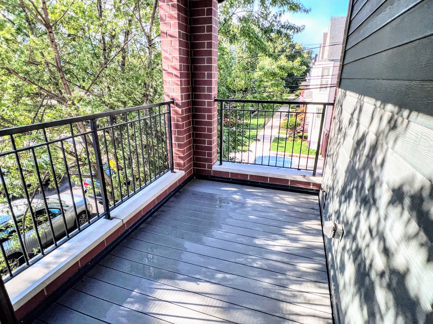 3203 North Ridgeway Avenue, Unit 3C Chicago, IL 60618 - Photo 15 of 17 a view of a balcony with wooden floor