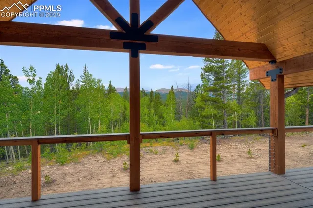 a view of a balcony with yard