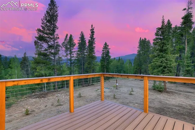 a view of outdoor space with deck and yard