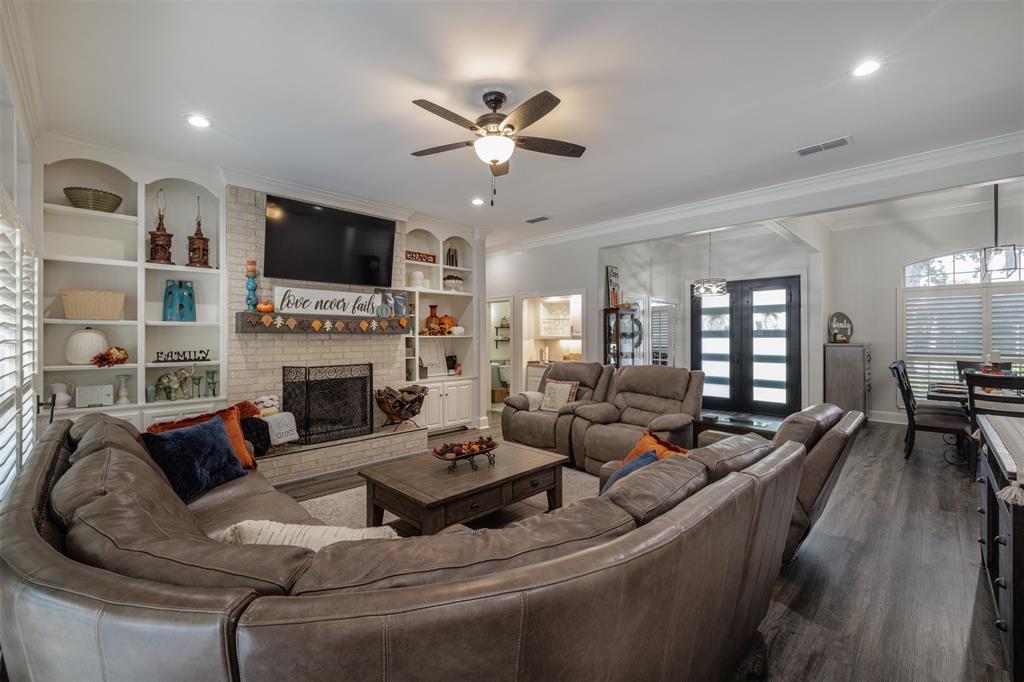 106 Graham Lane Bullard, TX 75757 - Photo 11 of 39 a living room with furniture fireplace and a flat screen tv