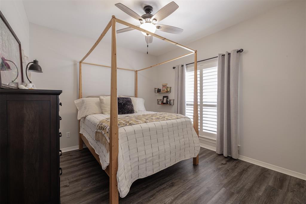 106 Graham Lane Bullard, TX 75757 - Photo 22 of 39 a bedroom with a bed and a ceiling fan
