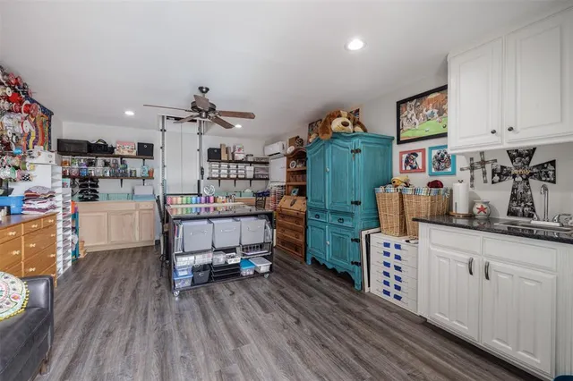 a room with lots of wooden furniture and a wooden floor