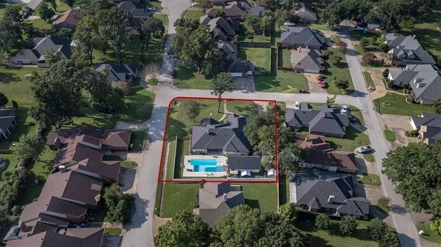 an aerial view of a house with a garden