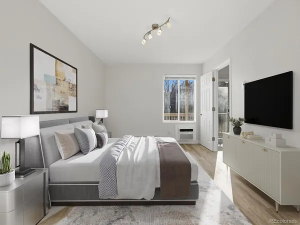 a living room with a flat screen tv and a couch