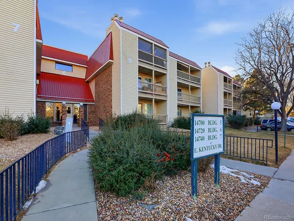 a front view of a house with a bench