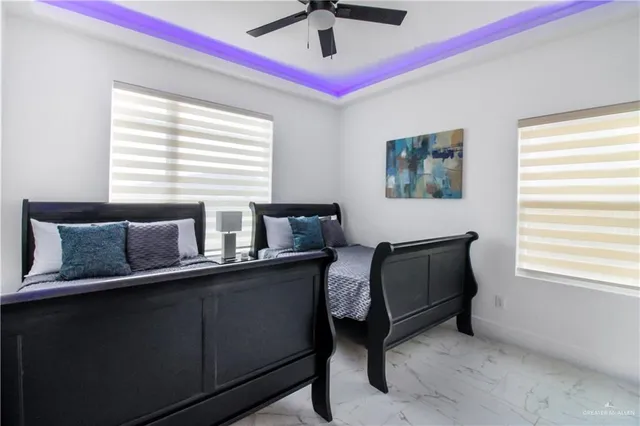 a white toilet sitting next to a bathroom sink