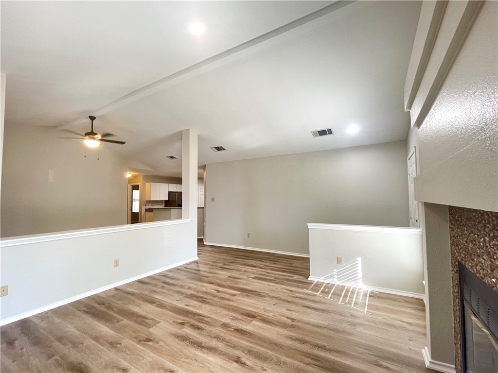 12333 Yarmont Way Austin, TX 78753 - Photo 11 of 40 a view of empty room with wooden floor