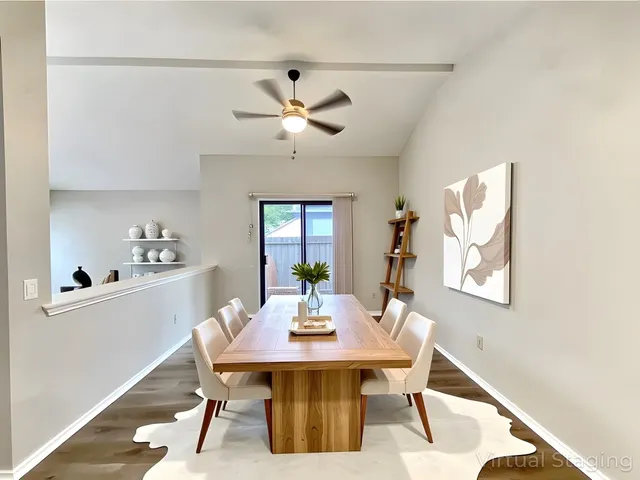 a view of a dining room with furniture