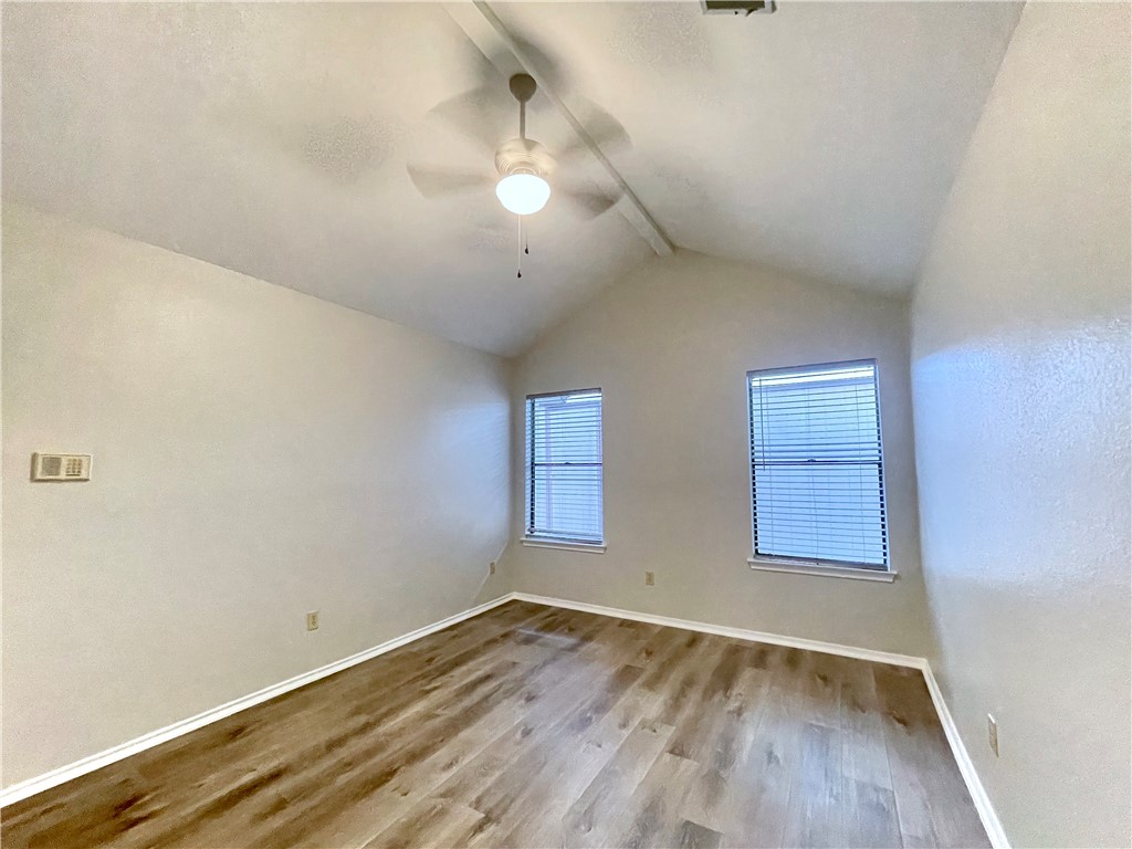 12333 Yarmont Way Austin, TX 78753 - Photo 26 of 40 an empty room with wooden floor and windows