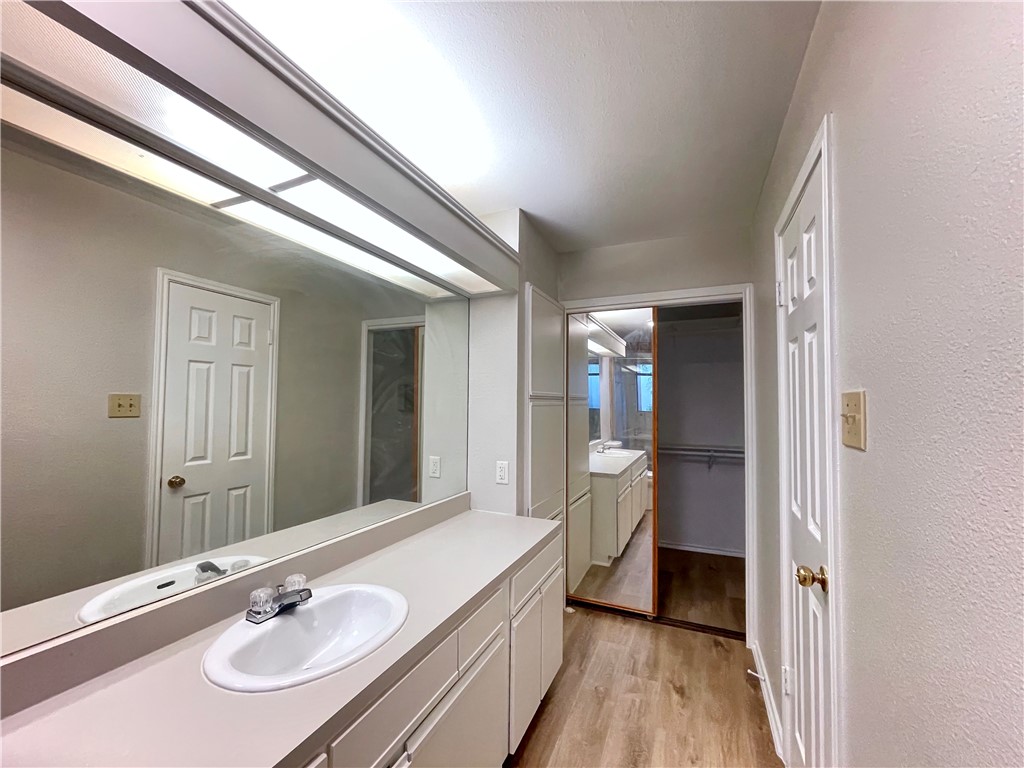 12333 Yarmont Way Austin, TX 78753 - Photo 31 of 40 a bathroom with a sink and a large mirror