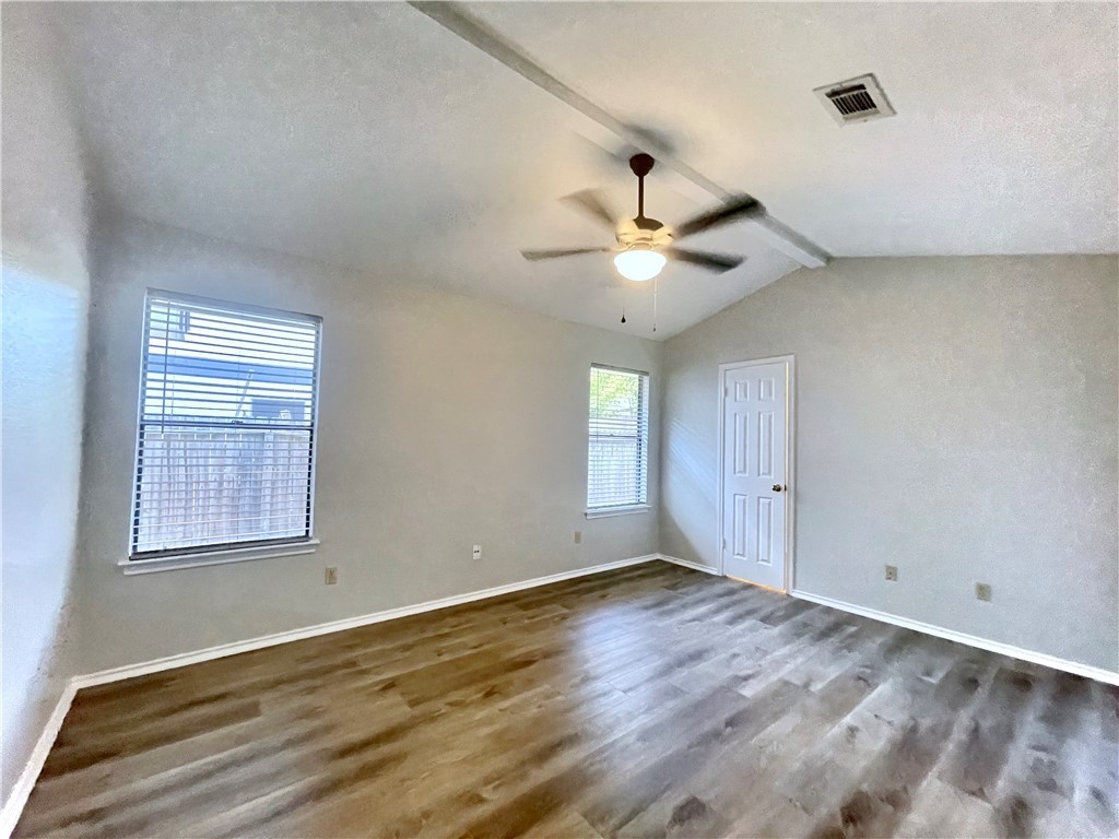 12333 Yarmont Way Austin, TX 78753 - Photo 33 of 40 a view of an empty room with wooden floor and a window