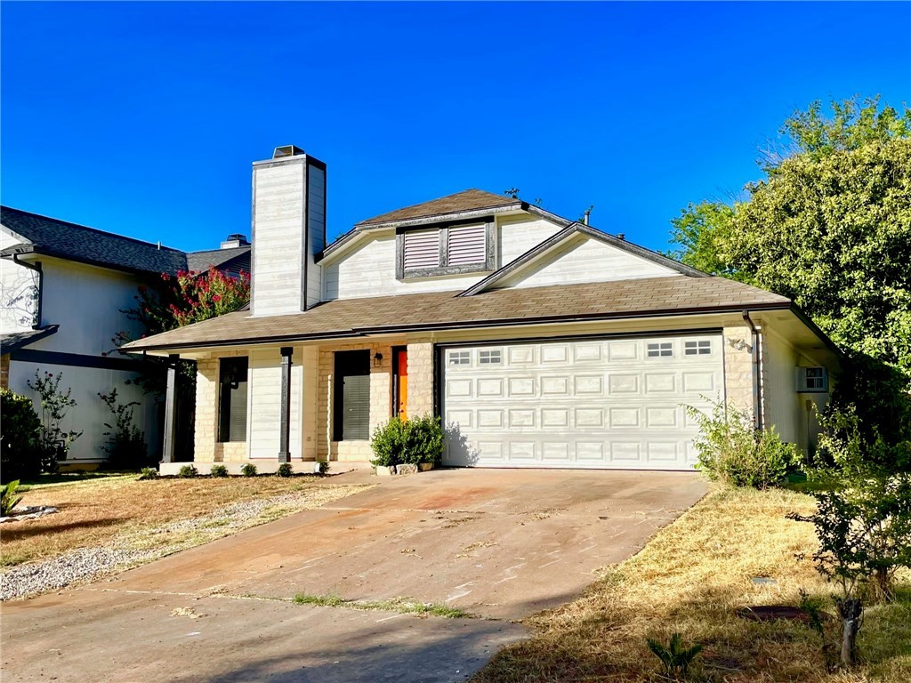 12333 Yarmont Way Austin, TX 78753 - Photo 4 of 40 a front view of a house with a yard