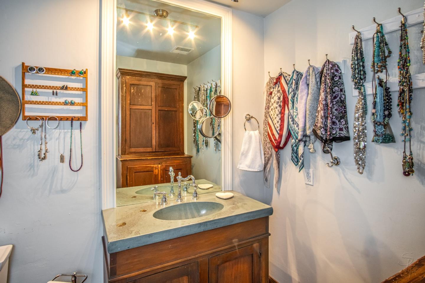 14520 Ridgecrest Road Watsonville, CA 95076 - Photo 27 of 49 a bathroom with a sink vanity and mirror