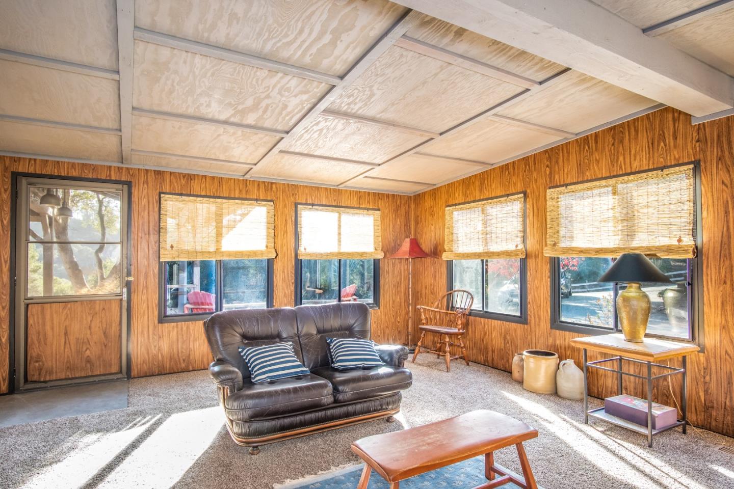 14520 Ridgecrest Road Watsonville, CA 95076 - Photo 31 of 49 a living room with furniture and floor to ceiling windows