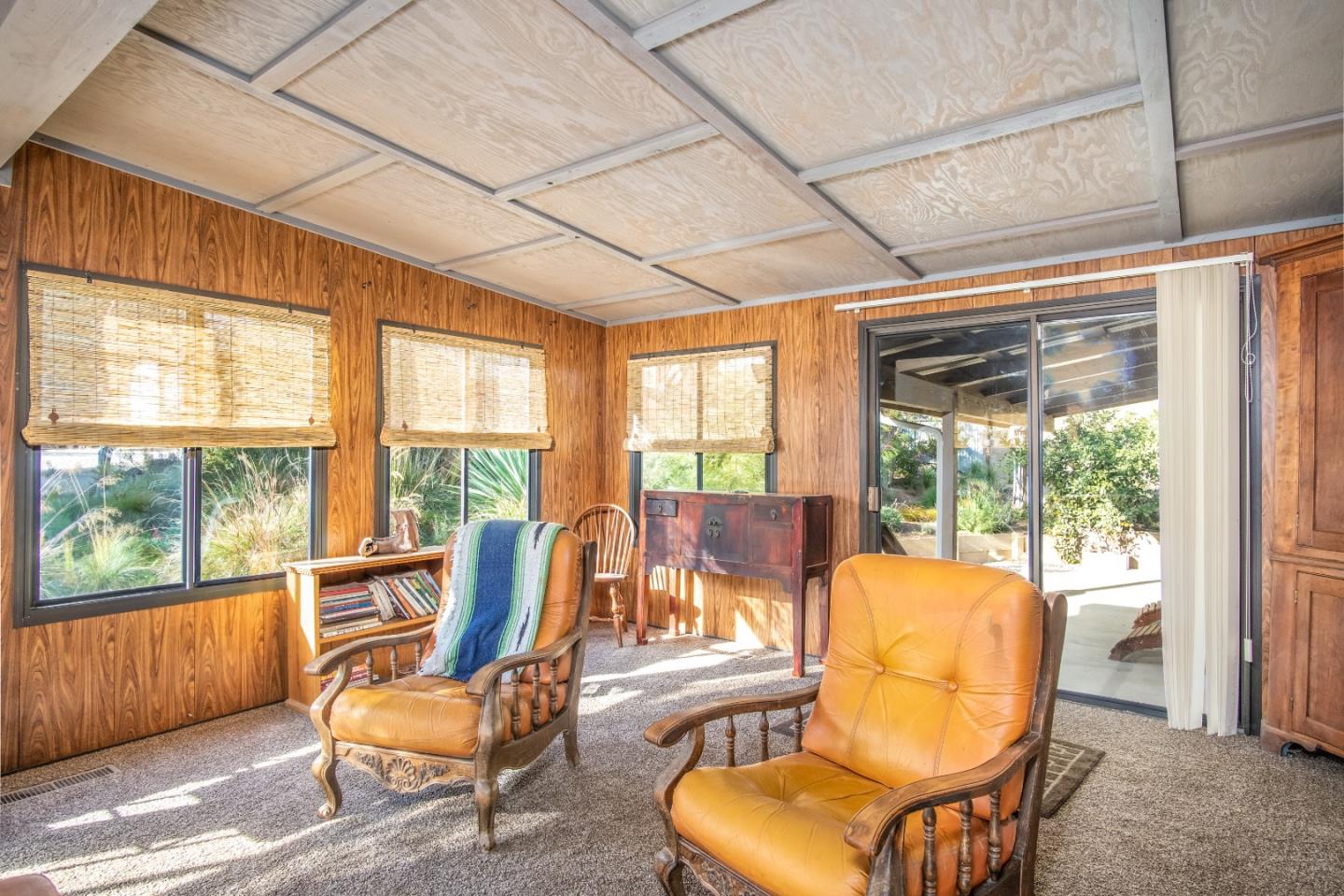14520 Ridgecrest Road Watsonville, CA 95076 - Photo 32 of 49 a living room with furniture and a floor to ceiling window