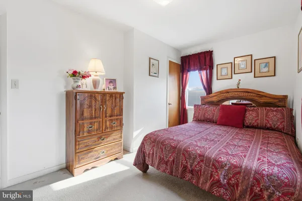 a bedroom with a bed and cabinets