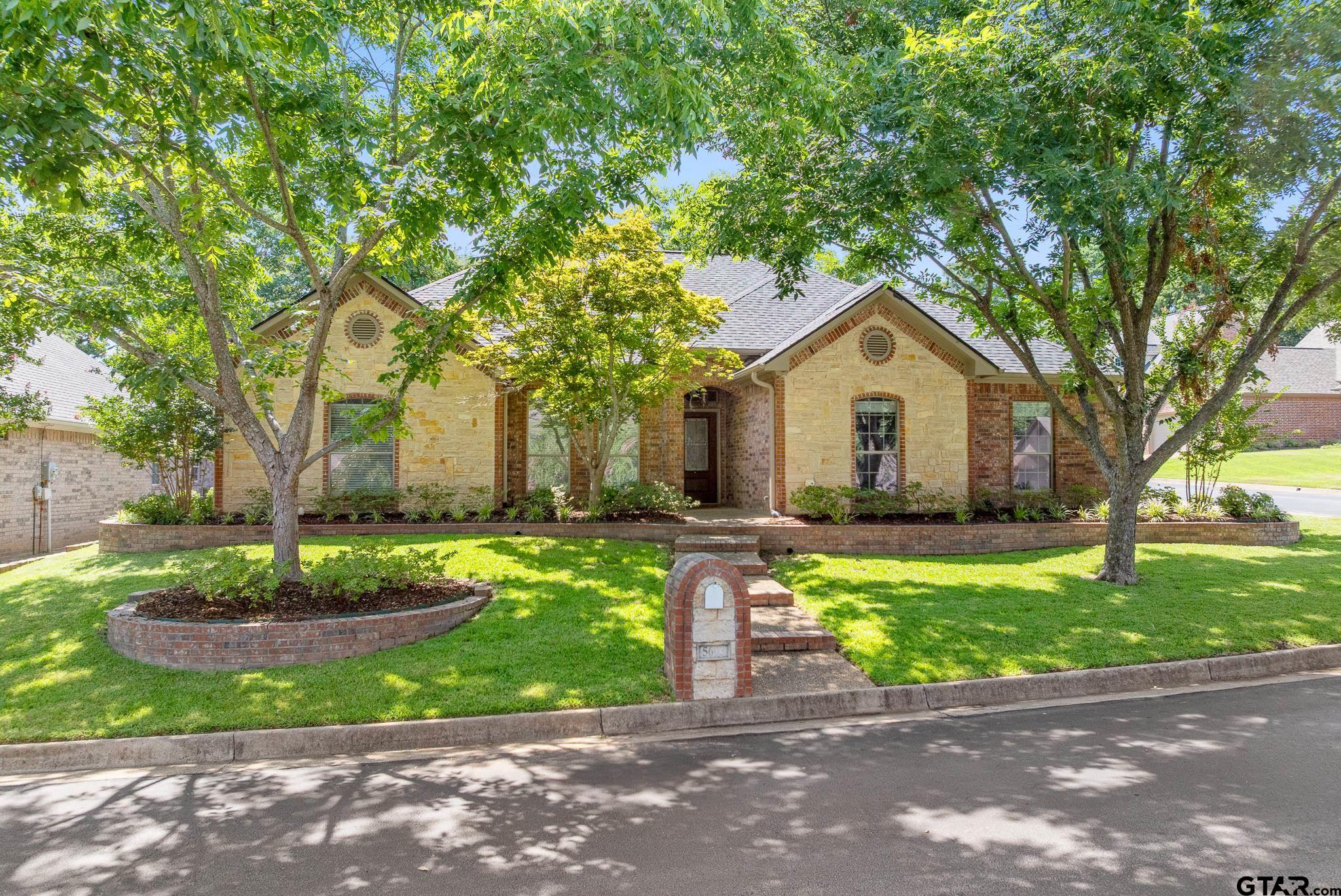 5603 Thomas Nelson Drive Tyler, TX 75707 - Photo 1 of 28 a front view of a house with a yard and garage