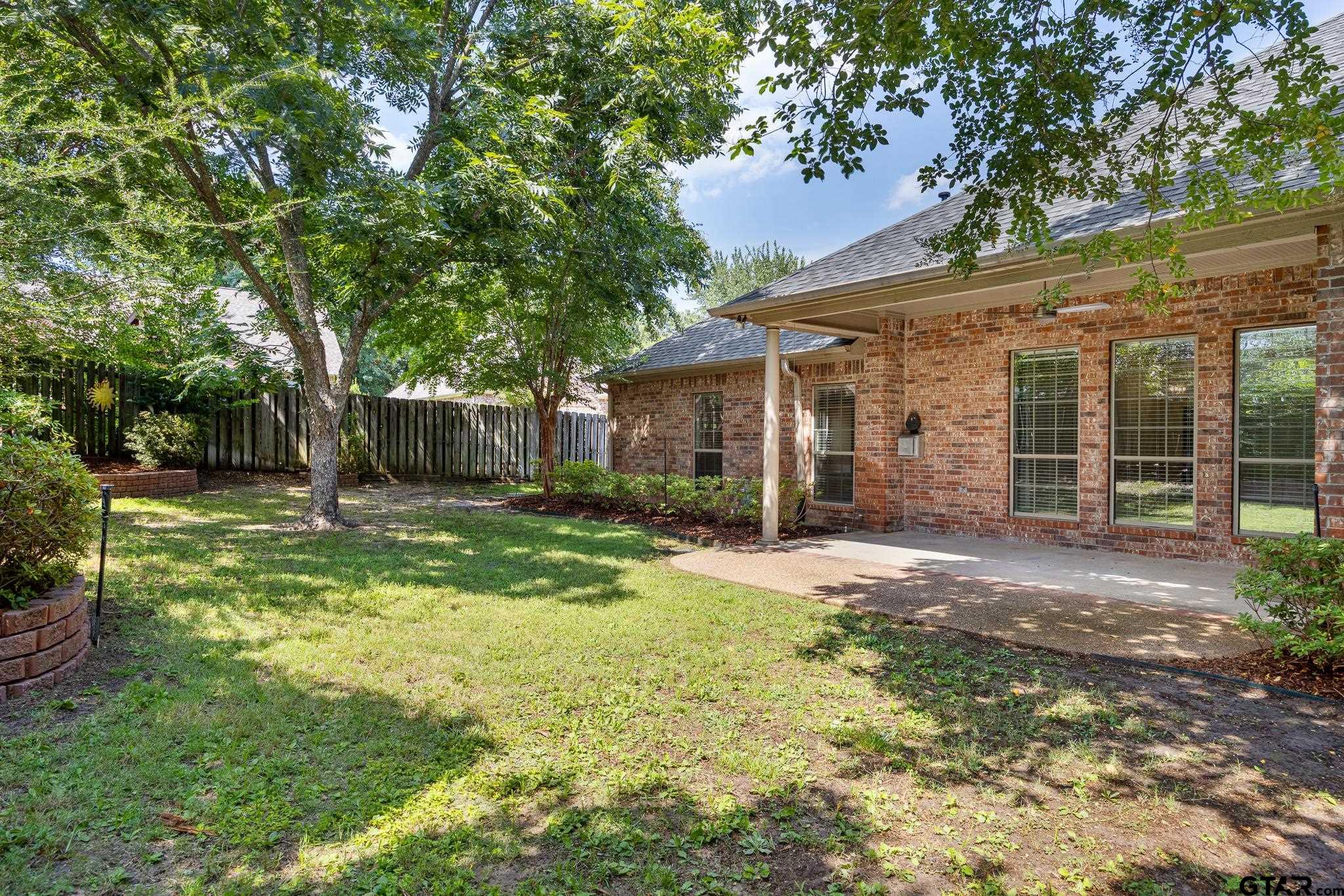 5603 Thomas Nelson Drive Tyler, TX 75707 - Photo 2 of 28 front view of a house with a yard