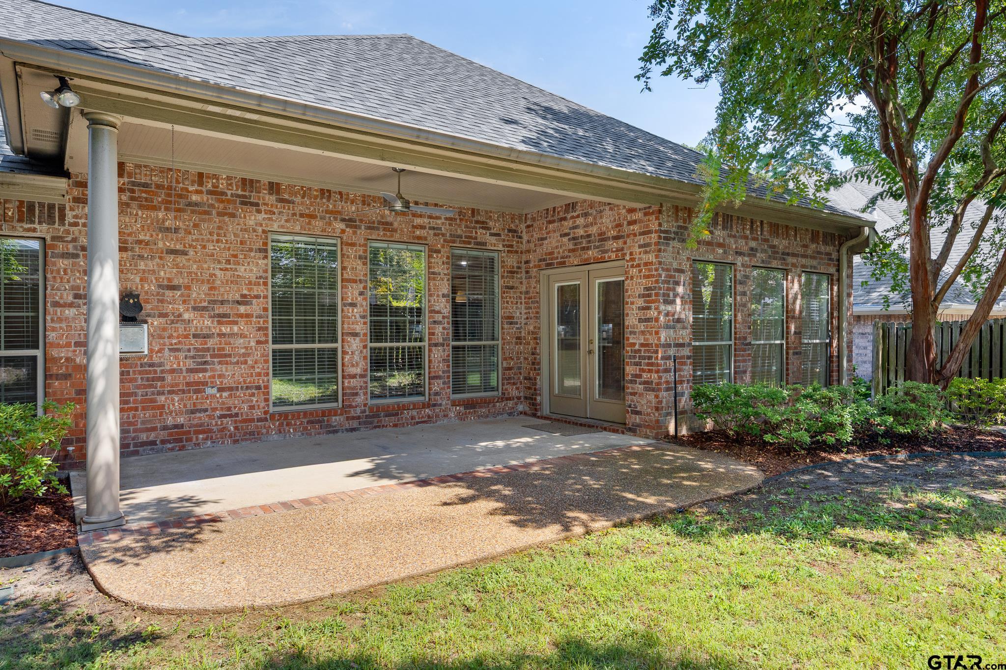 5603 Thomas Nelson Drive Tyler, TX 75707 - Photo 22 of 28 a view of a brick house with a large windows