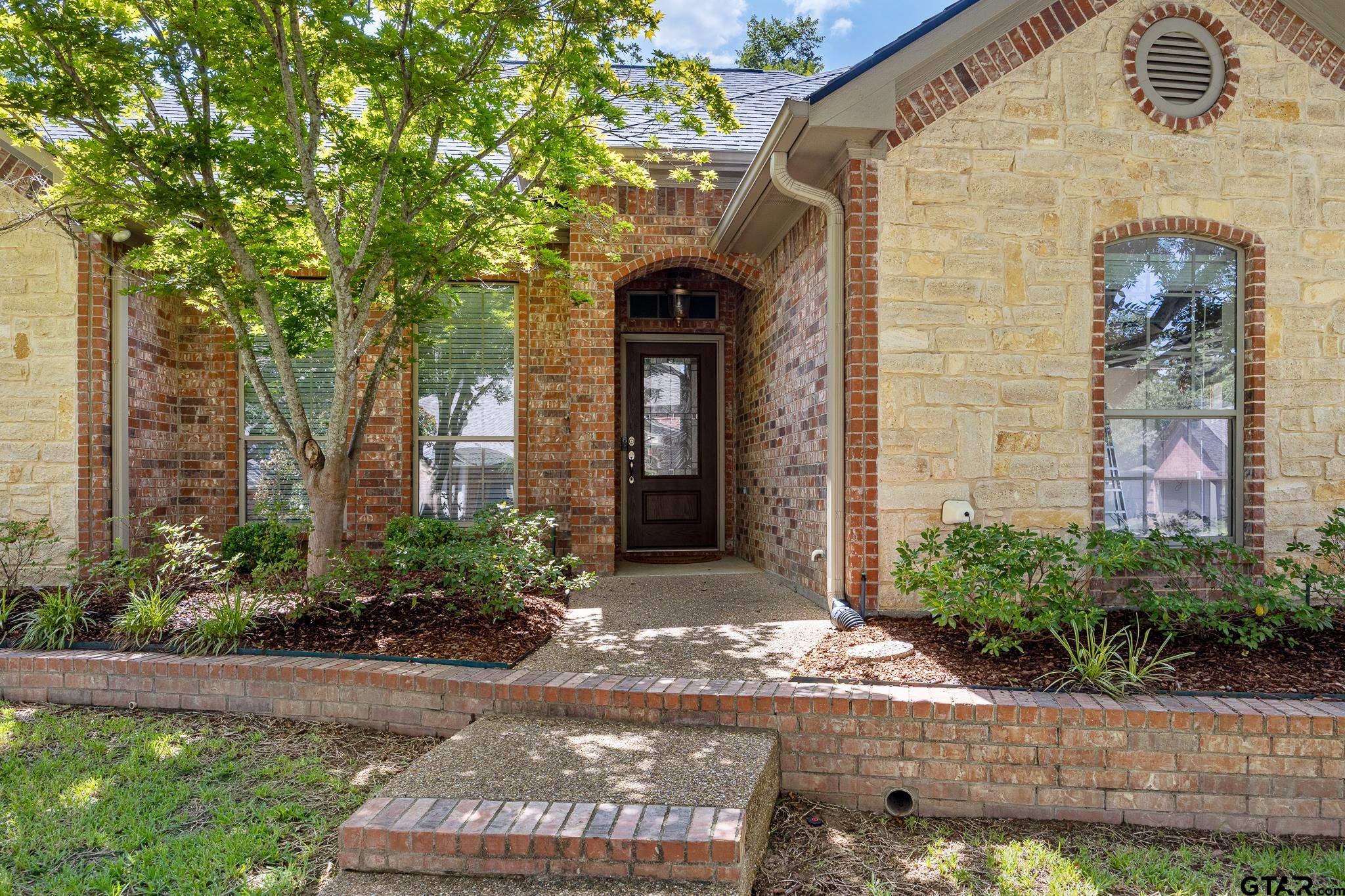 5603 Thomas Nelson Drive Tyler, TX 75707 - Photo 28 of 28 a front view of a house with a yard