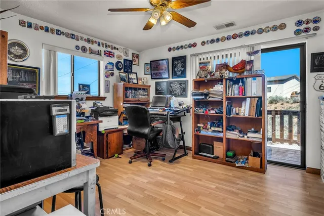a view of a workspace with furniture and toys