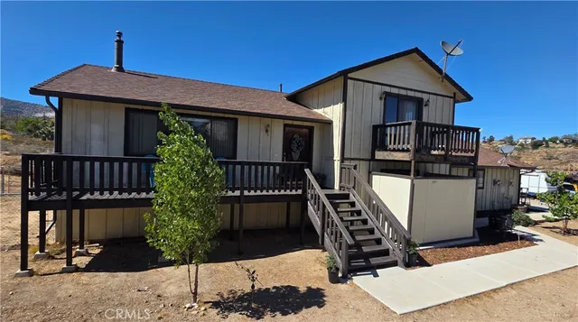 a front view of a house with yard