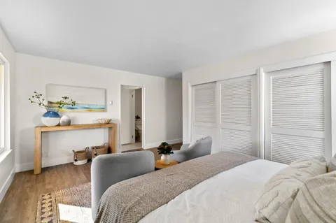 a bedroom with a bed and dresser