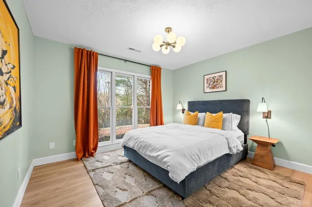 a backyard of a house with barbeque oven table and chairs