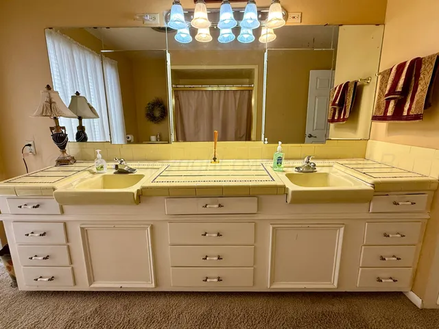 a bathroom with a sink and a mirror
