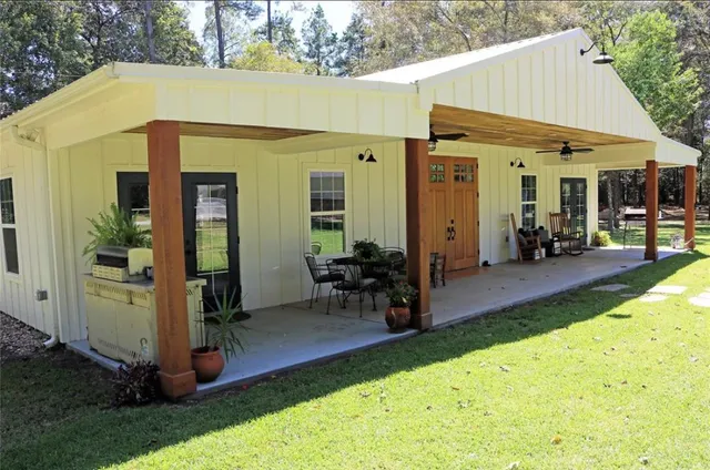 a large kitchen with a table and chairs