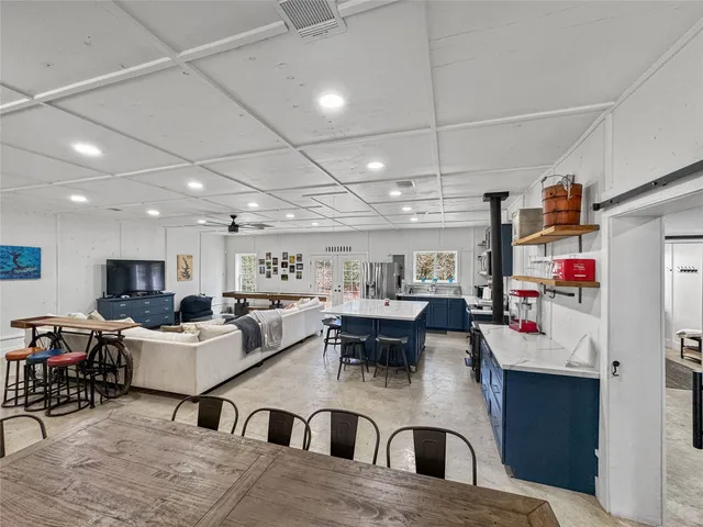 a bedroom with a large bed and a couch