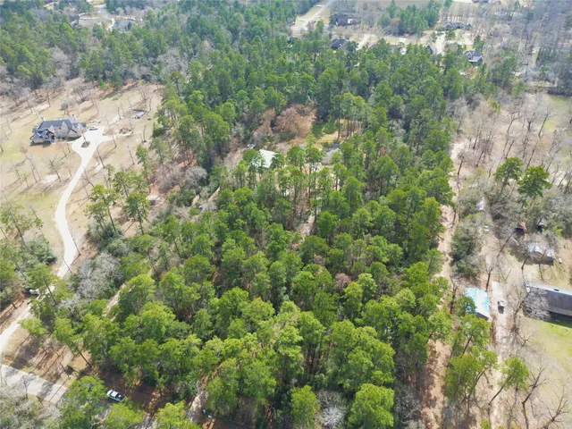 a backyard of a house with a yard and outdoor seating
