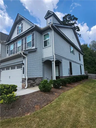 a front view of a house with garden