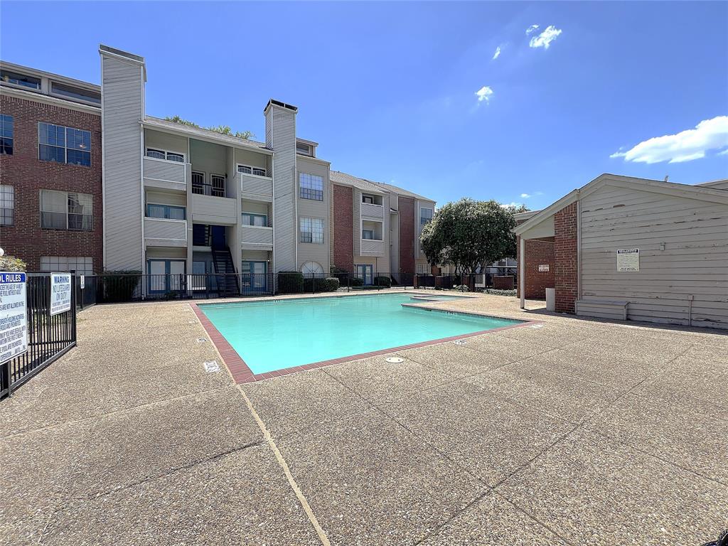 a view of a building with a yard