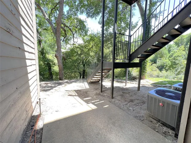 a view of a porch with furniture and a yard