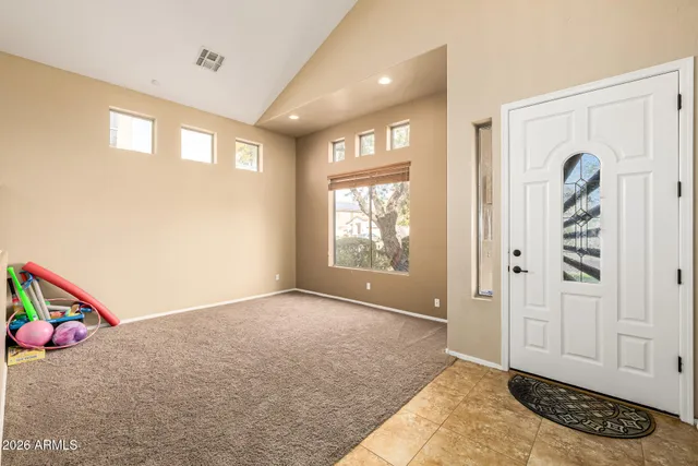 a bedroom with a bed dresser and a window