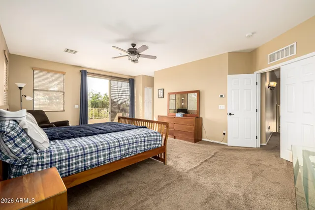 a bathroom with a granite countertop sink a mirror a bathtub and shower