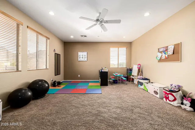 a view of a room with furniture and a large window