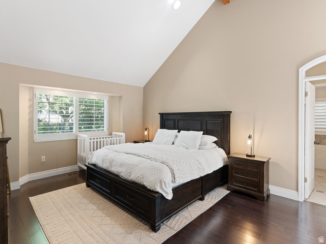 13357 Trail Rider Circle Draper, UT 84020 - Photo 25 of 70 Spacious room featuring vaulted ceilings, dark wood-finish flooring, and a large window with white plantation shutters