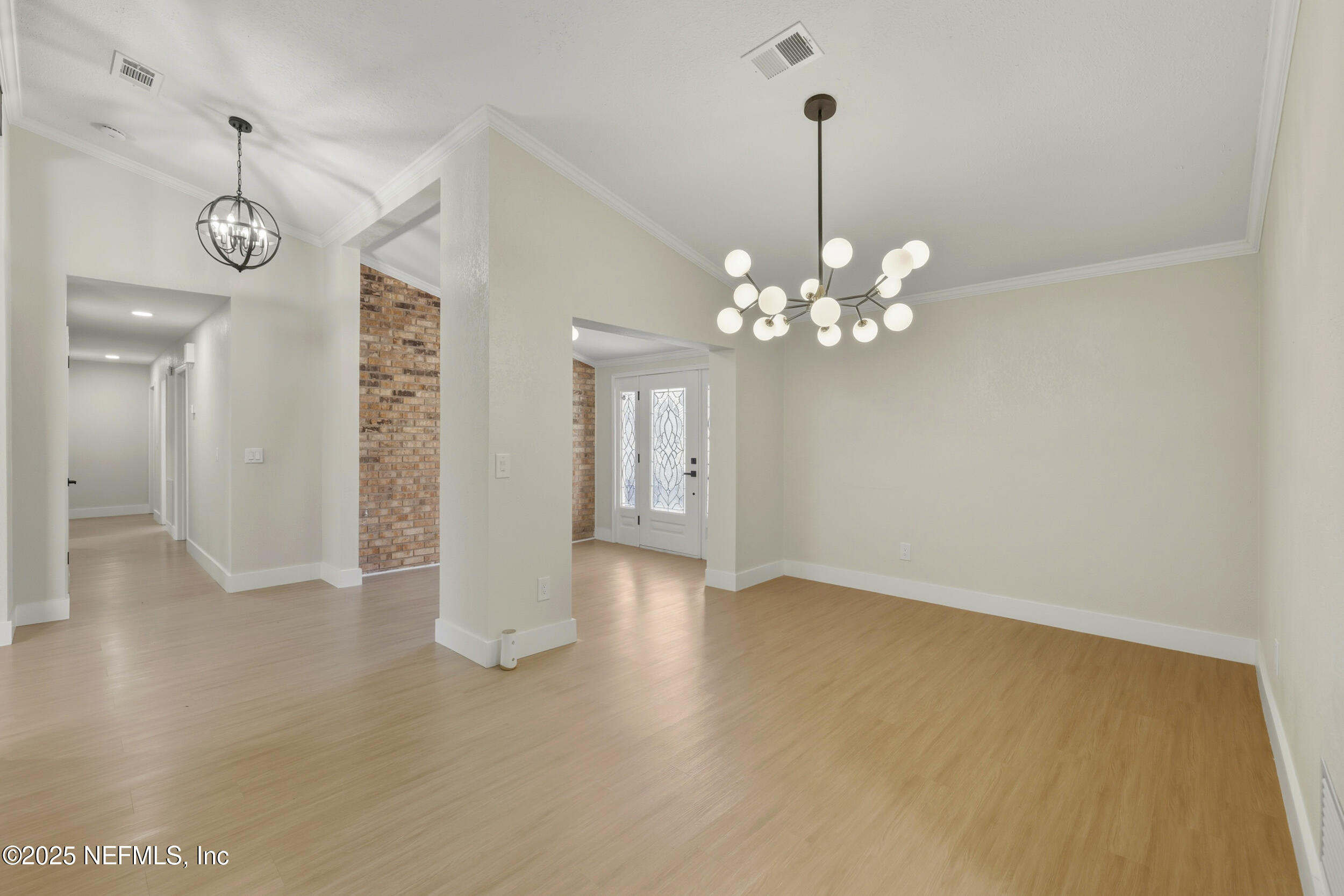11455 Scott Mill Road Jacksonville, FL 32223 - Photo 19 of 46 a view of a chandelier in big room and chandelier fan