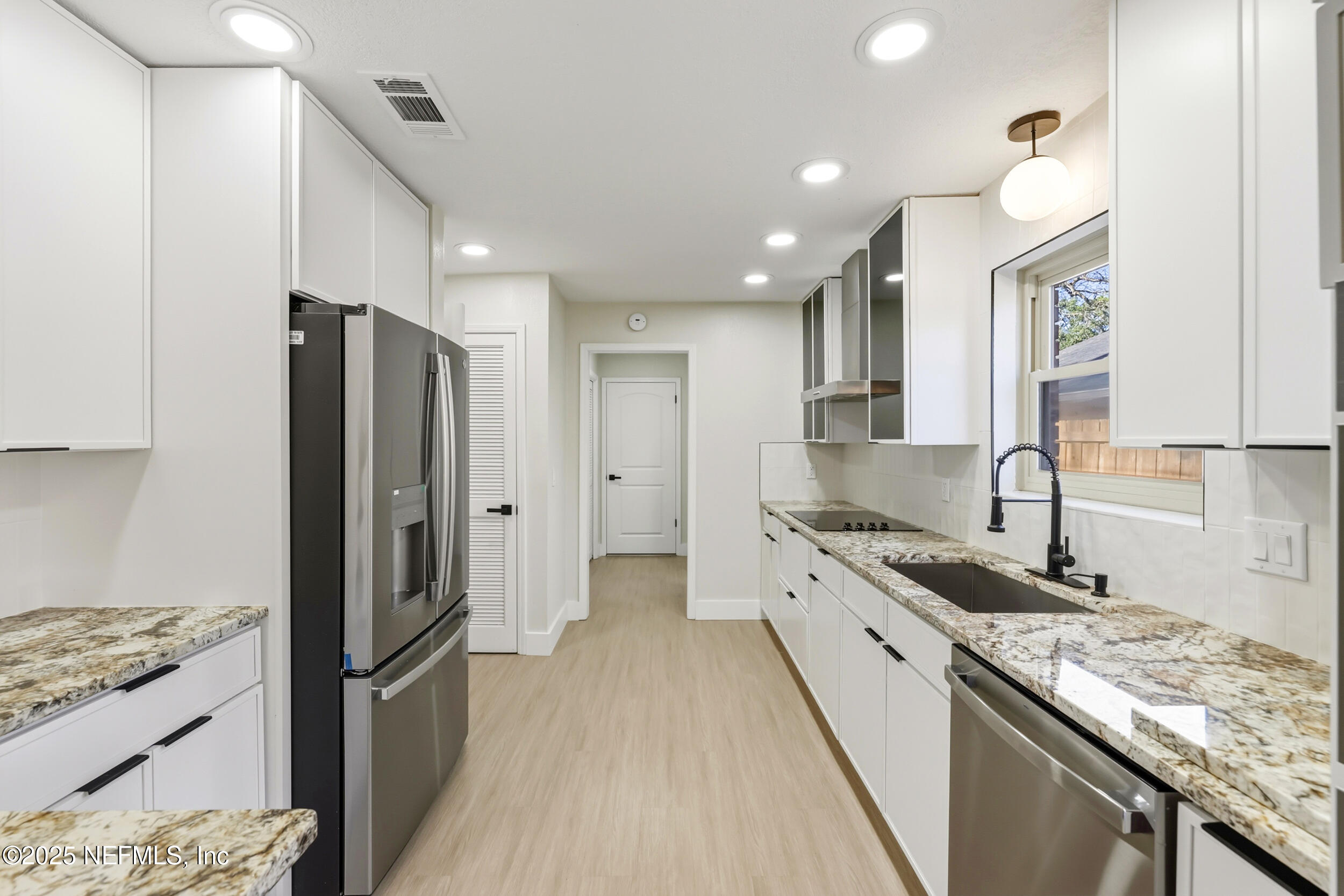 11455 Scott Mill Road Jacksonville, FL 32223 - Photo 27 of 46 a kitchen with stainless steel appliances granite countertop a refrigerator stove and sink