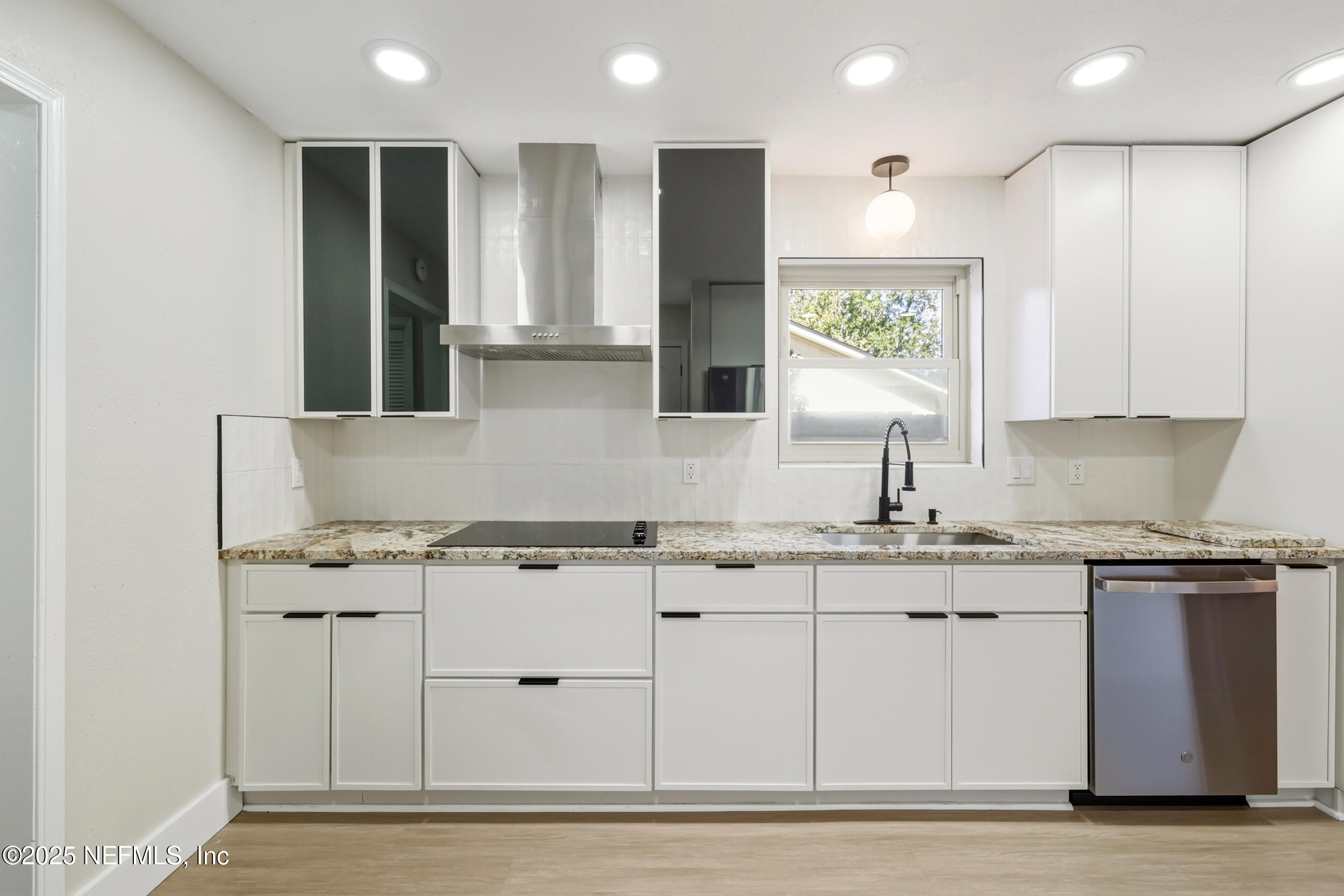 11455 Scott Mill Road Jacksonville, FL 32223 - Photo 28 of 46 a kitchen with stainless steel appliances granite countertop a sink a stove and a refrigerator